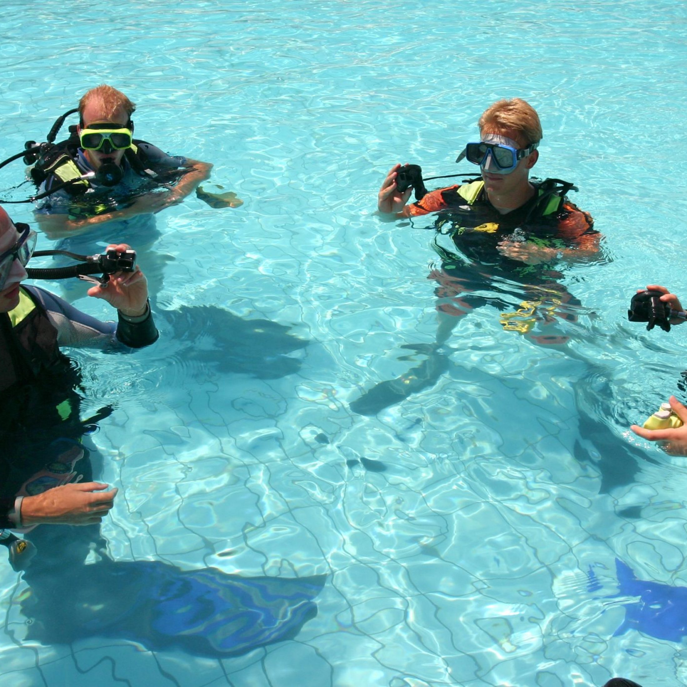 Instructor and students during scuba diving lessons